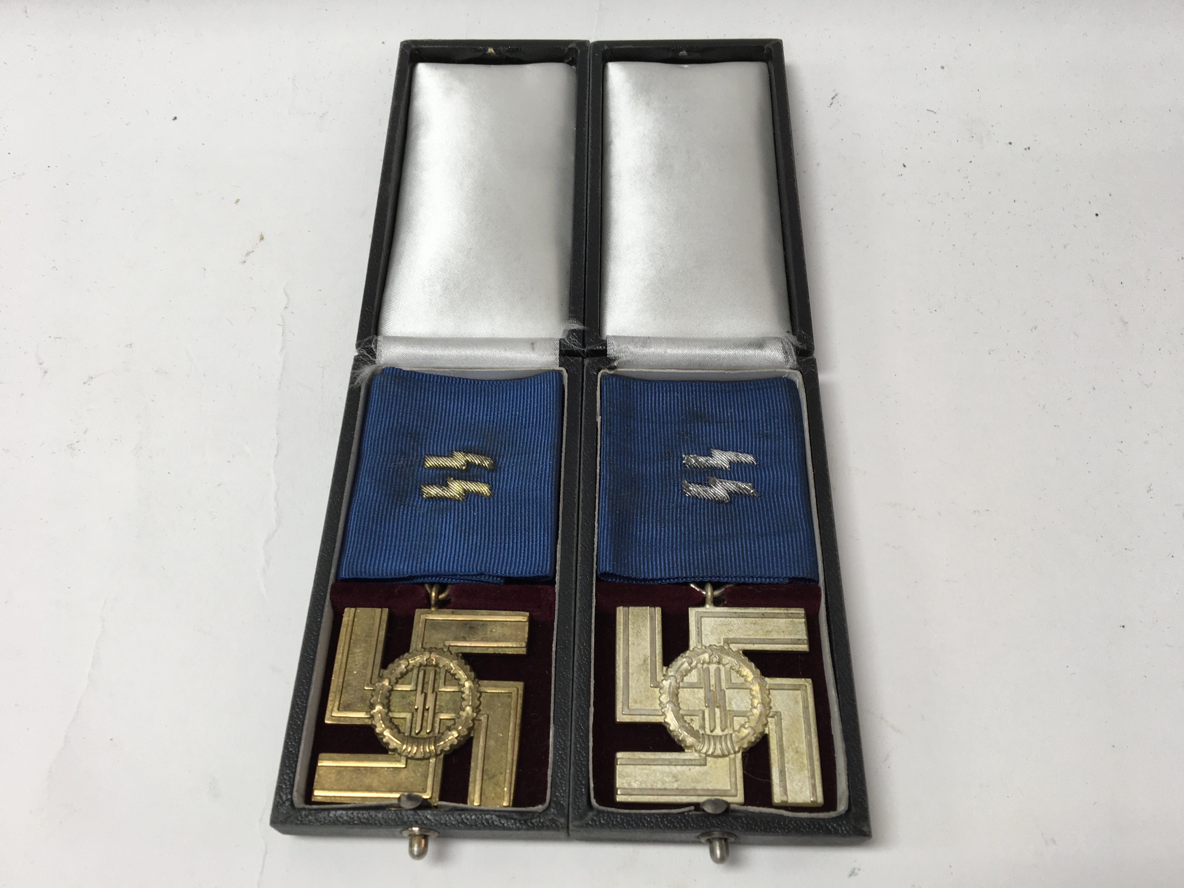 A pair of German WW2 SS long service awards, one f