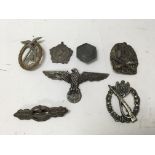 A group of WW2 badges including a Jewish Ghetto ba