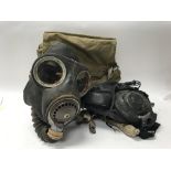 A 1941 V1 gas mask with bag, damaged rubber and a