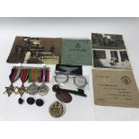 A small collection of ephemera and medals for an L