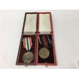 A pair of German WW2 medals comprising of an Octob