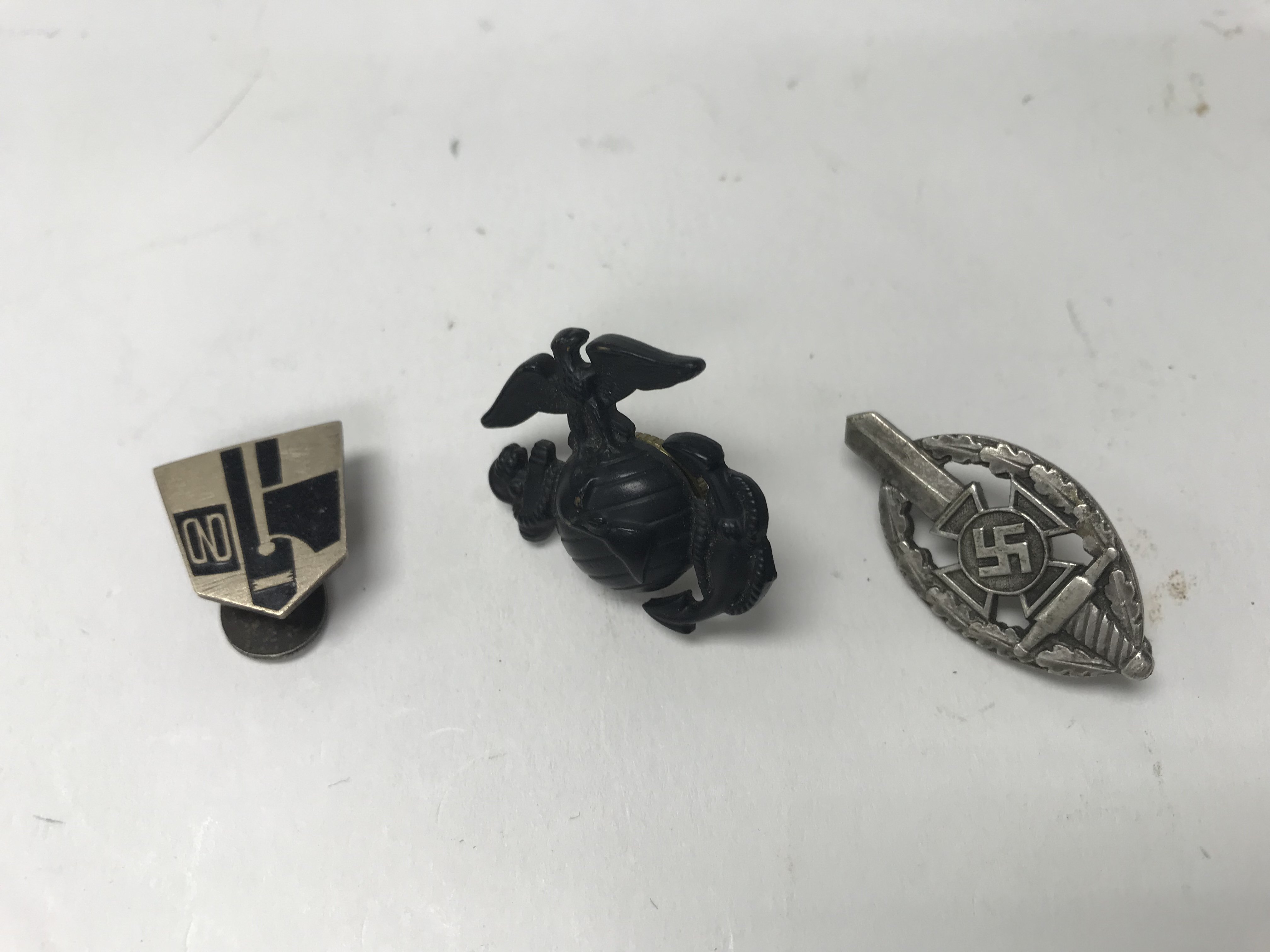 A group of three badges including an Italian Fasci