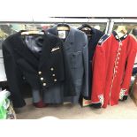A group of four military uniforms including an RAF