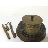 A Trench art Military cap made with a shell case w