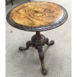 A walnut top occasional table on carved tripod foot.Approx 51x59cm high