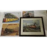 A group of framed railroad prints and steel wall p