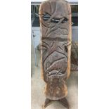 An interesting carved tribal interest chair, with markings. Height approx 102cm.