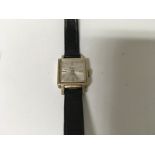 A 9 ct gold ladies pilot watch with leather strap