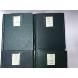 A group of 4 GB stamp albums, including Isle of Man and Jersey.