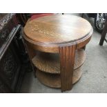 An oak Art Deco circular side table, approx diameter 58cm.