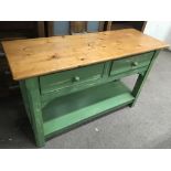 A green painted pine dresser base the rectangular top above two drawers 131cmx48cm