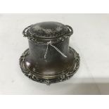 A silver capstan inkwell, with glass inset