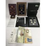 A collection of commemorative and proof coin sets.