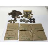 A bag containing a collection of various coinage, including circulated coinage.