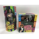 Two boxed Austin Powers 'Dr Evil' figures.