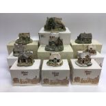 A collection of boxed Lilliput Lane cottages.