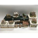 A box of Lilliput Lane and David Winter cottages and other other buildings, some with boxes and