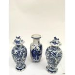 Three Chinese blue and white vases including two decorated with dragons.Approx 23and 20cm