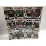 A collection of boxed Funko pops, mint and boxed and a box containing various plush toys including a