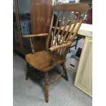 A beech and elm Windsor open armchair.