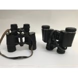 Two pairs of binoculars.