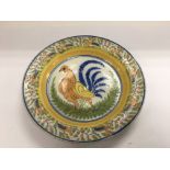A French glazed dish with a handpainted cockerel t