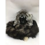 A Canadian fur trimmed snood and a fox tail stole