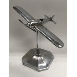 A 1930s chrome Schneider cup aeroplane on stand, approx 28cm.