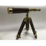 A 20th Century mahogany and brass telescope on sta