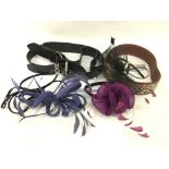 A group of belts and hair fascinators