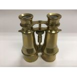A pair of brass binoculars.