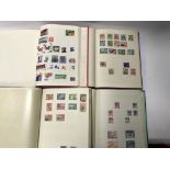 A group of four world stamp albums from the 19th century onwards to include Canada, Antigua,