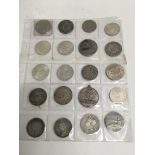 A group of 20 coins & others containing mainly crowns, including foreign coins and a Walt Disney