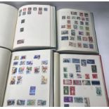 Another group of 4 world stamp albums from the 19th century onwards including USA, Guernsey,