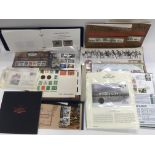 A collection of stamps, coin covers etc.