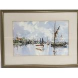 A framed and glazed watercolour of Maldon depicting boats along the quayside, approx 53.5cm x 39.