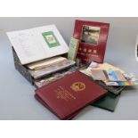 A box file of loose stamps sorted into countries, 1988 and 1997 Chinese commemorative albums, a