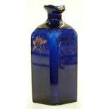 A 19th century Bristol blue glass 'Rum' decanter with faceted edges and gilt decoration, possible