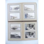 Two photograph albums c1923, beginning with Opobo, Nigeria and including shipping scenes, the