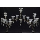 A silver plated epergne with 21 clear glass flutes, each with frilled ends, 63cm long