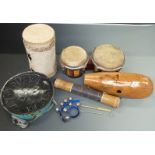 A collection of percussion instruments to include a steel pan drum, bongos, bells etc
