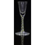 Mike Hunter Twists Glass clear drinking glass with white twist surrounding yellow, white and blue