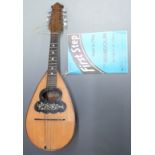 Carlo Overi and Figlio 19thC round back Napolese mandolin with floral and foliate decoration to