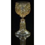 Moser style drinking glass with all over enamelled decoration of flowers on a clear ground, 14cm