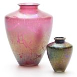 Two Royal Brierley iridescent glass vases, one on cranberry, the other on blue ground, largest