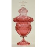 Bohemian cranberry glass comport and cover with deep cut decoration, raised on pedestal base, 32cm