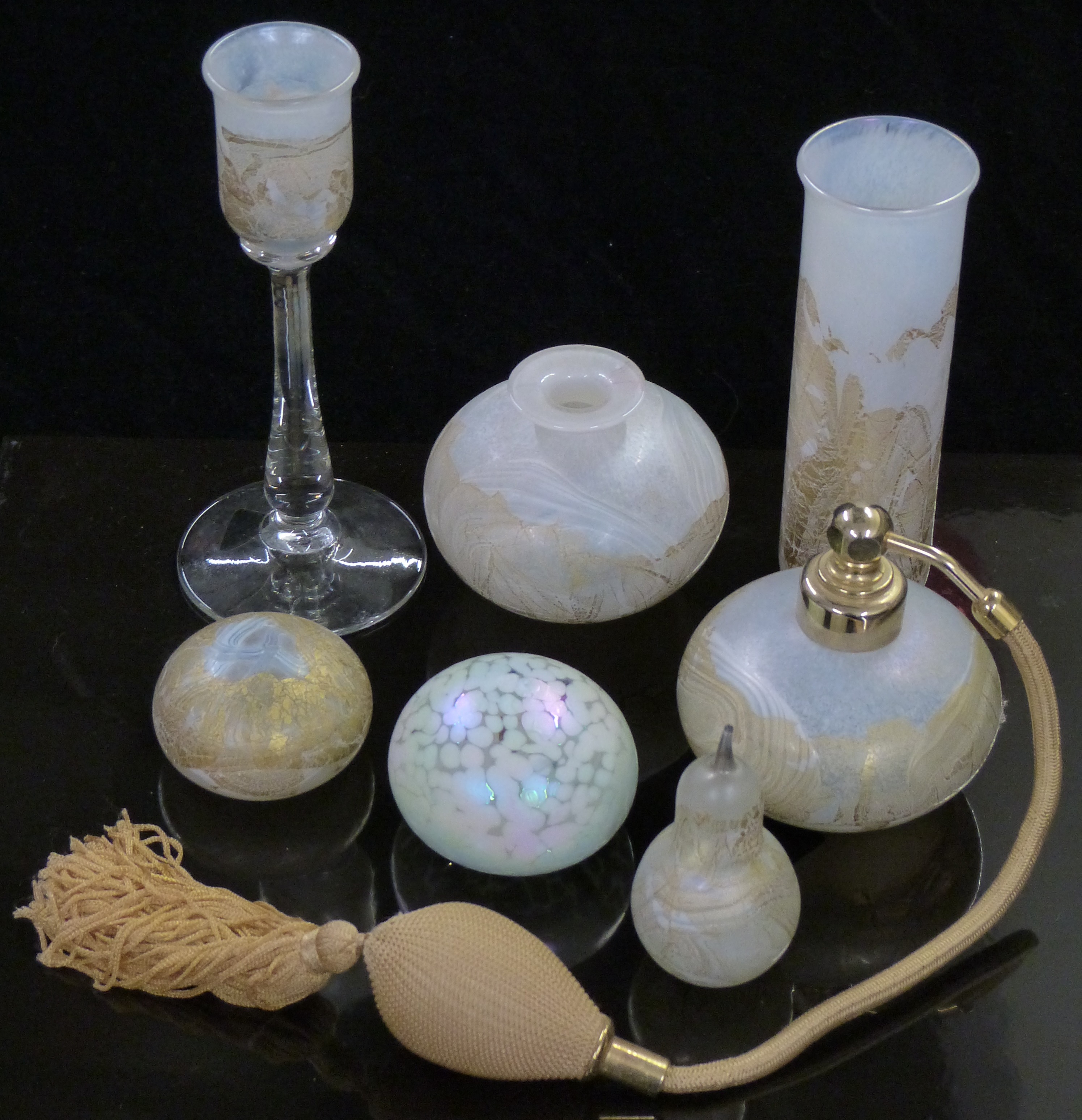 Seven pieces of Isle of Wight glassware including paperweights, vases, atomiser etc., all with
