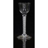 An 18thC clear drinking glass with opaque double twist stem and ogee shaped bowl raised on conical