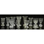 Eleven 19thC and later cut glass vases, some with knopped stems and some raised on square cut bases,