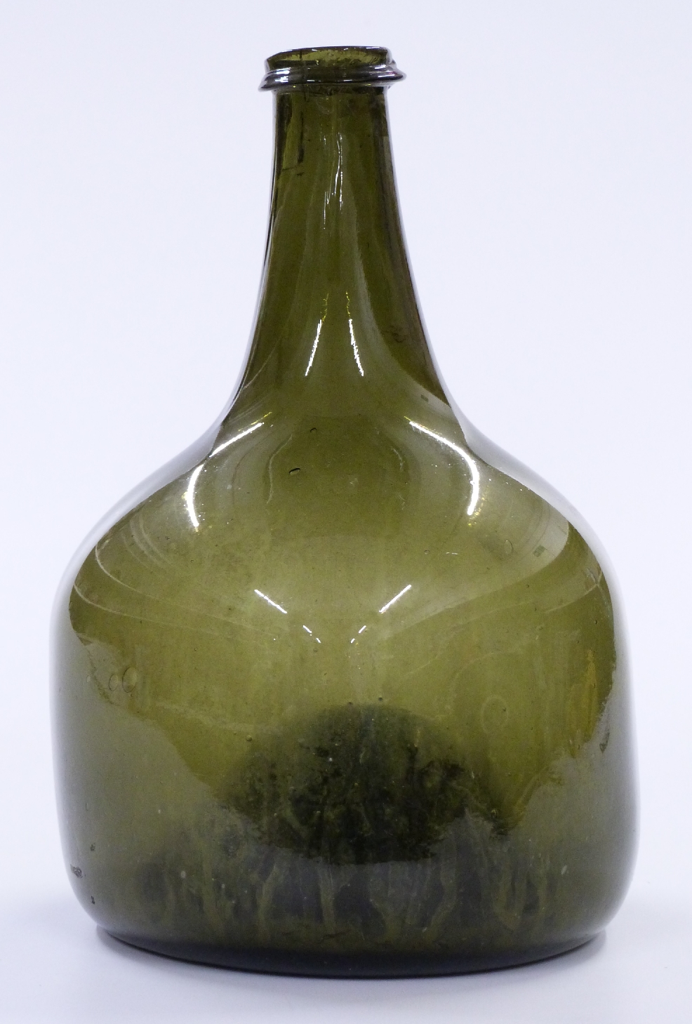 An 18thC green glass onion wine bottle, 24cm tall.